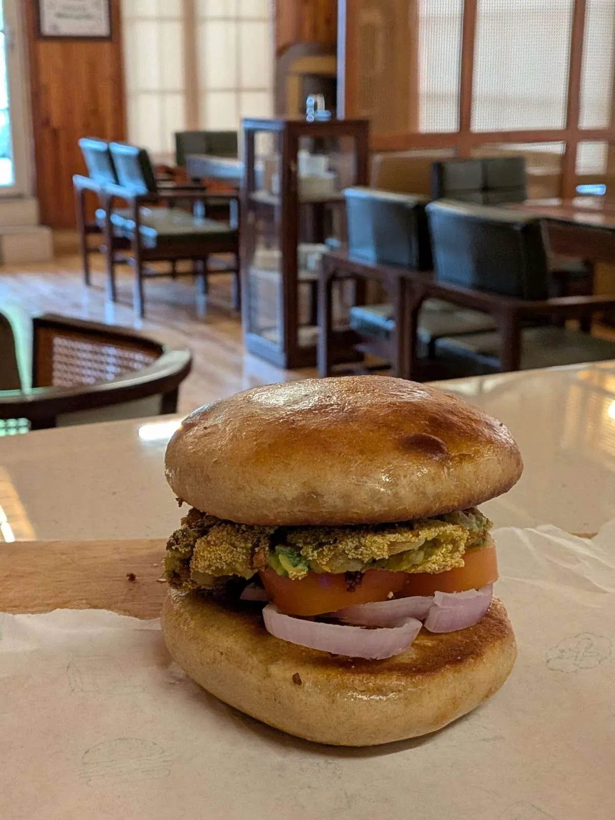 A burger served inside the café